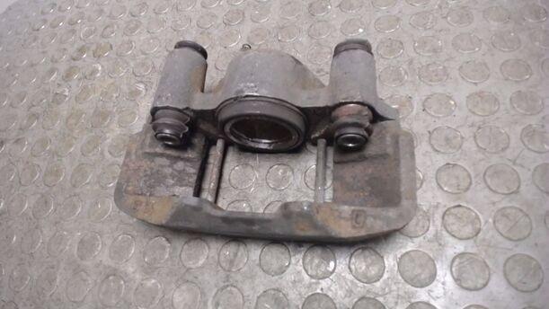 Foto: BREMSSATTEL VORN LINKS eines Mazda 323 1.6i GLX