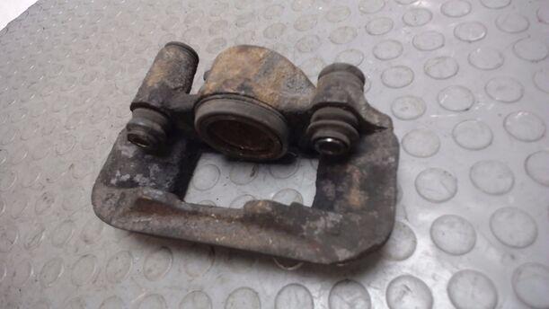 Foto: BREMSSATTEL VORN LINKS eines Mazda 121 16V Canvas Top Start
