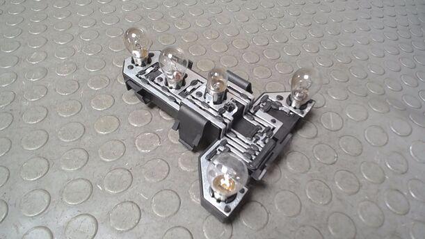 Foto: LAMPENTRÄGER HINTEN LINKS eines VW Golf 1.4 Aktion