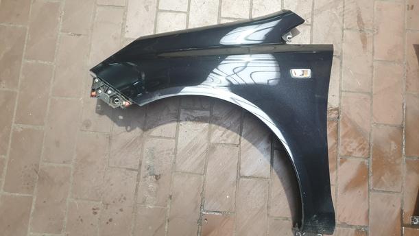 Foto: KOTFLÜGEL LINKS eines Opel Corsa 1.4 16V