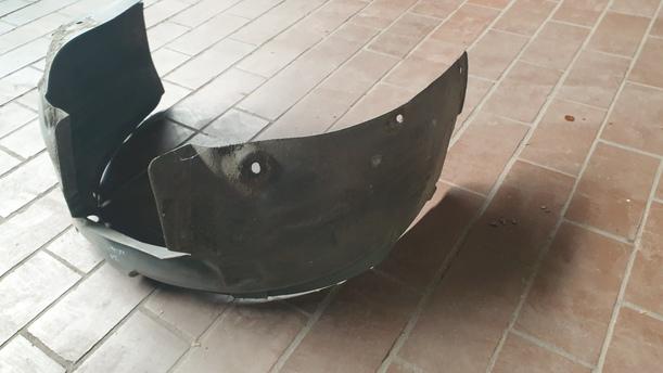 Foto: INNENKOTFLÜGEL / RADHAUSSCHALE LINKS eines Opel Corsa 1.2 16V