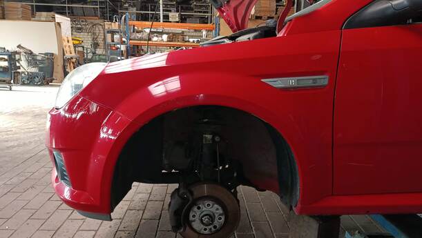 Foto: KOTFLÜGEL LINKS eines Opel Tigra Twin Top 1.3 CDTI