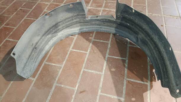 Foto: RADHAUSSCHALE / INNENRADHAUS VORN LINKS eines Opel Tigra Twin Top 1.3 CDTI