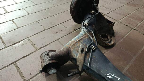 Foto: HINTERACHSE / ACHSTRÄGER HINTEN eines VW Polo 1.2