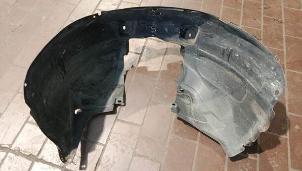Foto: RADHAUSSCHALE/ INNENRADHAUS VORN LINKS eines Opel Corsa 1.2 16V