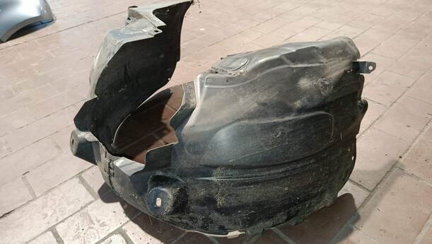Foto: RADHAUSSCHALE/ INNENRADHAUS VORN LINKS eines Opel Corsa 1.2 16V