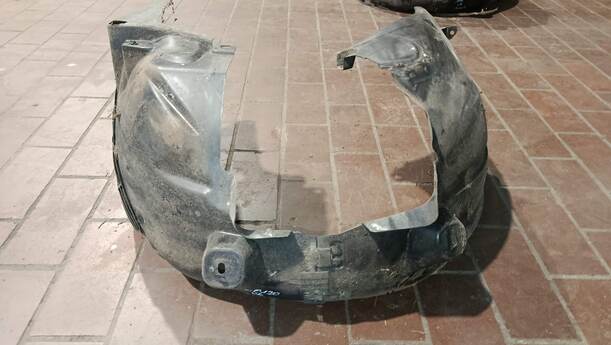 Foto: RADHAUSSCHALE/ INNENRADHAUS VORN LINKS eines Opel Corsa 1.2 16V