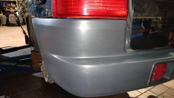 Foto: STOSSFÄNGER/ STOßSTANGE HINTEN ( UNLACKIERT ) eines Mazda Demio 1.4