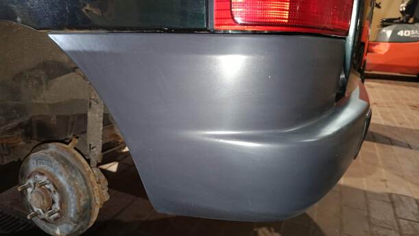 Foto: STOSSFÄNGER/ STOßSTANGE HINTEN ( UNLACKIERT ) eines Mazda Demio 1.4
