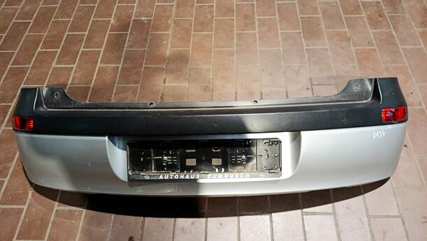 Foto: STOSSFÄNGER/ STOßSTANGE HINTEN ( VOR FACELIFT ) eines Opel Corsa 1.0 12V