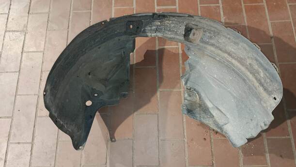 Foto: RADHAUSSCHALE/ INNENRADHAUS VORN LINKS eines Opel Corsa 1.4 16V GLS