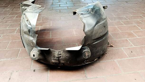 Foto: RADHAUSSCHALE / INNENKOTFLÜGEL LINKS eines Opel Corsa 1.4 16V