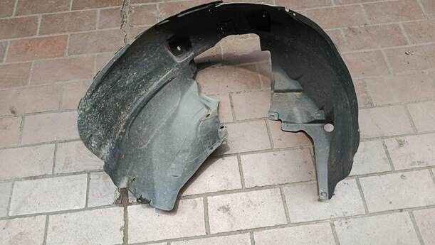 Foto: RADHAUSSCHALE / INNENKOTFLÜGEL RECHTS eines Opel Corsa 1.4 16V